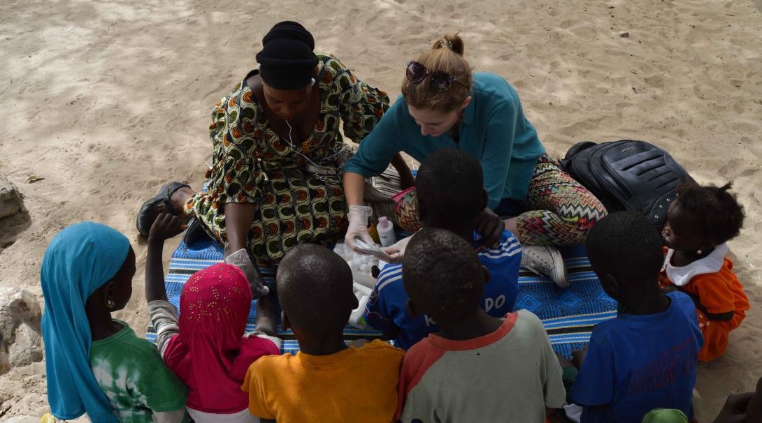 A Projects Abroad volunteer provides medical care for her volunteer work with children in Senegal. A volunteer with children in Senegal provides medical care during an outreach.
